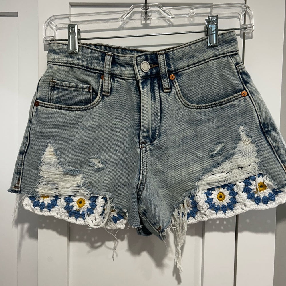 Blank NYC Gray Jean Shorts with Distressed Detailing and Floral Embellishments
